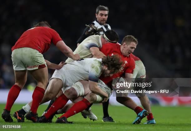 Bradley Davies of Wales is tackled by Alec Hepburn during the NatWest Six Nations match between England and Wales at Twickenham Stadium on February...