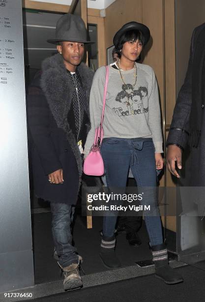 Pharrell Williams and Helen Lasichanh depart Nobu restaurant on February 6, 2014 in London, England.