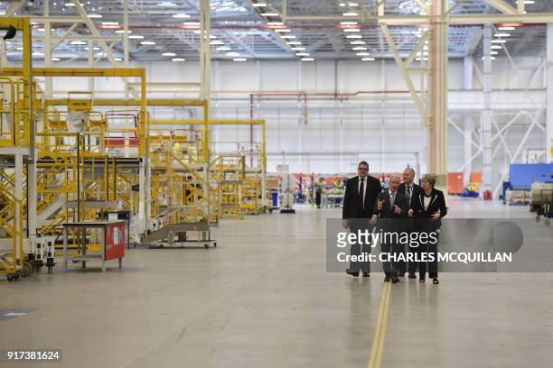 British Prime Minister Theresa May is shown around by Michael Ryan , president of Bombardier Aerostructures and Engineering services division, during...