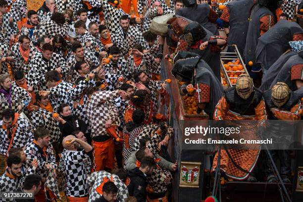 Orange battle teams' members participate in the traditional Battle of the Oranges on February 11, 2018 in Ivrea, Italy. The Battle of the Oranges,...
