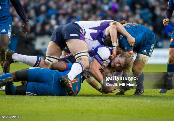 Scotland's David Denton is tackled at Murrayfield on February 11, 2018 in Edinburgh, Scotland.