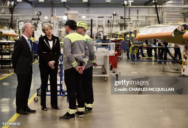 British Prime Minister Theresa May speaks to workers, accompanied by Michael Ryan , president of Bombardier Aerostructures and Engineering services...