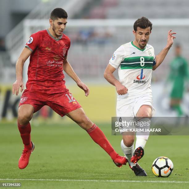 Qatar's Al-Duhail Karim Boudiaf vies for the ball against Iranian Zobahan club's Ghasem Haddadifar during their AFC Champions League match between...