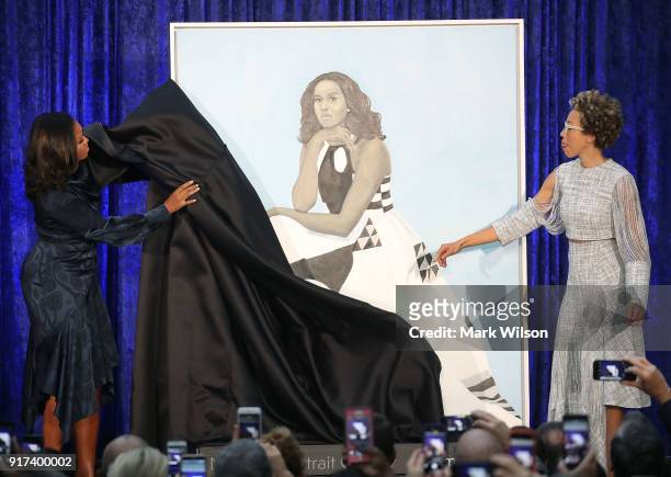 Former U.S. First lady Michelle Obama and artist Amy Sherald unveil her portrait during a ceremony at the Smithsonian's National Portrait Gallery, on...