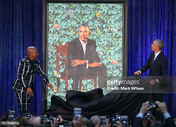 Former U.S. President Barack Obama and artist Kehinde Wiley unveil his portrait during a ceremony at the Smithsonian's National Portrait Gallery, on...