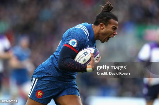 Teddy Thomas of France breaks clear to score his first try during the Six Nations match between Scotland and France at Murrayfield on February 11,...