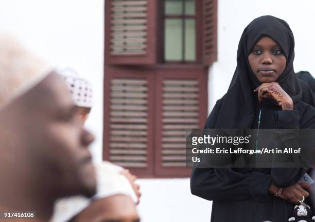 Muslim veiled young woman in the street during Maulidi festivities, Lamu County, Lamu Town, Kenya on December 16, 2017 in Lamu Town, Kenya.