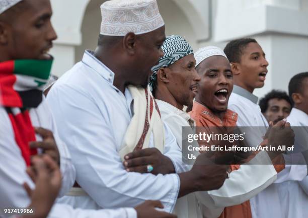 Sunni muslim men dancing during the Maulidi festivities in the street, Lamu County, Lamu Town, Kenya on December 16, 2017 in Lamu Town, Kenya.