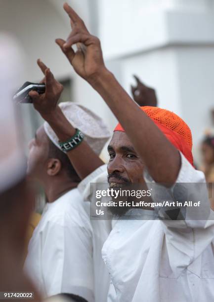 Sunni muslim men celebrating the Maulidi festivities in the street, Lamu County, Lamu Town, Kenya on December 16, 2017 in Lamu Town, Kenya.