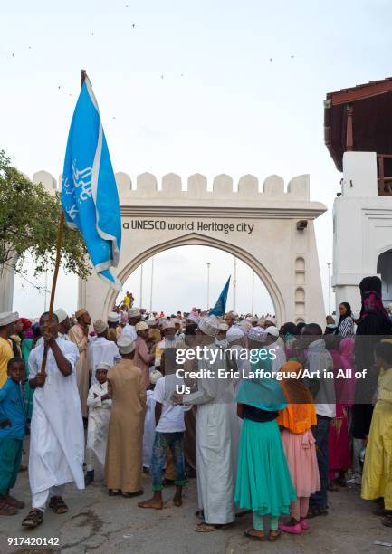 Sunni muslim people parading in front of the town gate during the Maulidi festivities in the street, Lamu County, Lamu Town, Kenya on January 1, 2012...