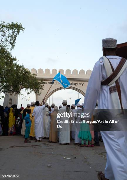 Sunni muslim people parading in front of the town gate during the Maulidi festivities in the street, Lamu County, Lamu Town, Kenya on January 1, 2012...