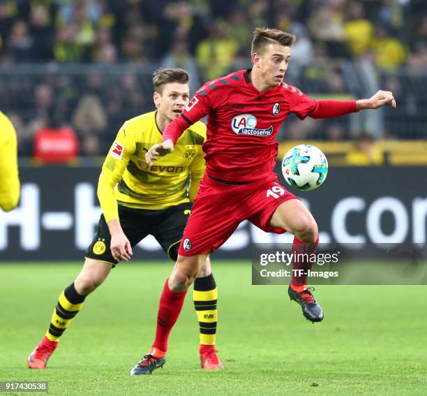 Lukasz Piszczek of Dortmund and Janik Haberer of Freiburg battle for the ball during the Bundesliga match between Borussia Dortmund and Sport-Club...