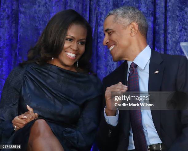Former U.S. President Barack Obama and first lady Michelle Obama participate in the unveiling of their official portraits during a ceremony at the...