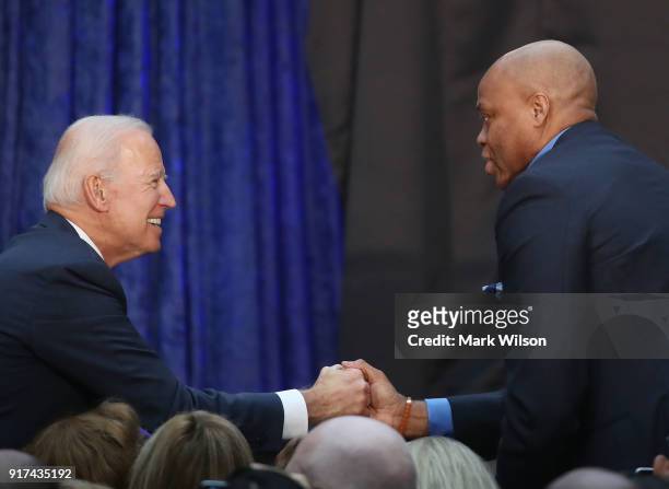 Former U.S. Vice President Joseph Biden, , greets Craig Robinson, during the official portrait unveiling of former U.S. President Barack Obama and...
