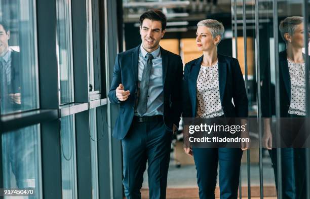 two business people taking - looking away stock pictures, royalty-free photos & images