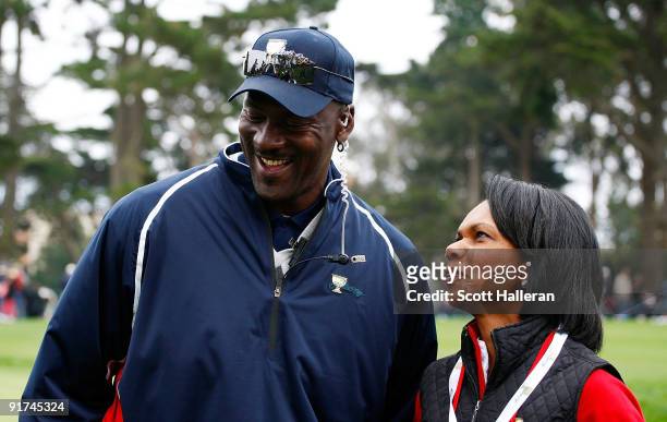 Condoleezza Rice waits alongside Team USA assistant Michael Jordan on the fifth hole during the Day Three Afternoon Fourball Matches of The...