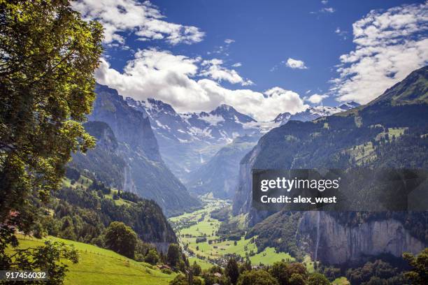 a view down the lauterbrunnen valley. - lauterbrunnen stock pictures, royalty-free photos & images