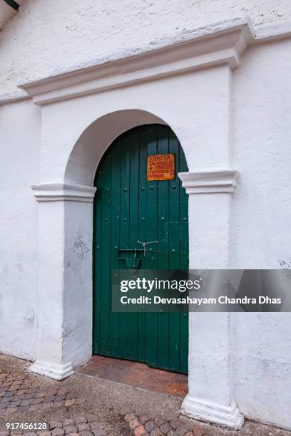 bogota, colombia - entrance to the chapel known as ermita de san miguel del principe on plaza chorro de quevedo - plaza del chorro de quevedo stock pictures, royalty-free photos & images