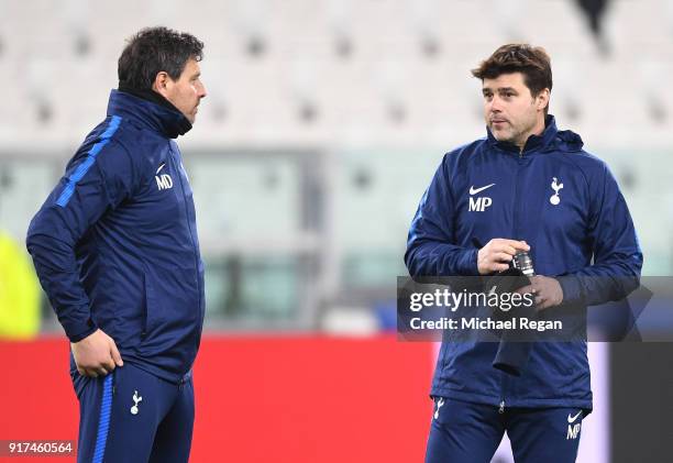 Mauricio Pochettino, Manager of Tottenham Hotspur speaks to Miguel D'Agostino, Tottenham Hotspur first team coach during the Tottenham Hotspur FC...