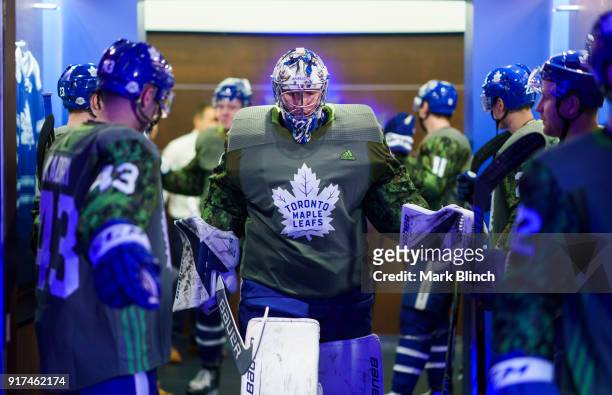 Frederik Andersen of the Toronto Maple Leafs walks out of the dressing room while wearing a camouflage jersey to honour the Canadian Armed Forces...