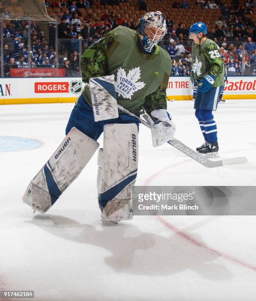 Frederik Andersen of the Toronto Maple Leafs skates while wearing a camouflage jersey to honour the Canadian Armed Forces during warm up before...