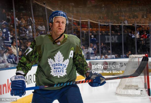 Leo Komarov of the Toronto Maple Leafs skates while wearing a camouflage jersey to honour the Canadian Armed Forces during warm up before playing...