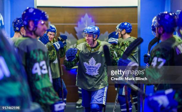 Mitchell Marner of the Toronto Maple Leafs walks out of the dressing room while wearing a camouflage jersey to honour the Canadian Armed Forces...