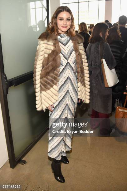 Olivia Palermo poses for a photo outside of the Zimmermann fashion show in Gallery I during IMG NYFW: The Shows at Spring Studios on February 12,...