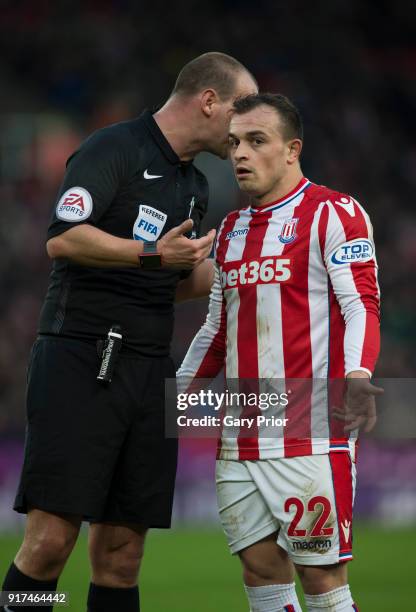 Referee Robert Madley in conversation with Xherdan Shaqiri of Stoke City during the Premier League match between Stoke City and Brighton and Hove...