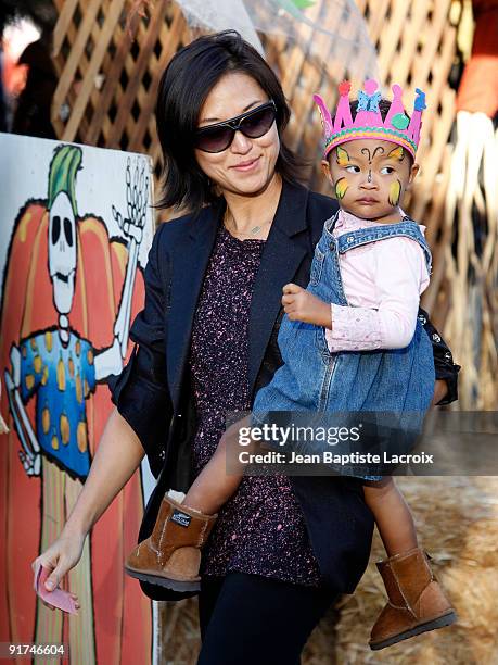 Christine Kim and Luisa Danbi Grier-Kim visit Mr Bones Pumpkin Patch in West Hollywood on October 10, 2009 in Los Angeles, California.