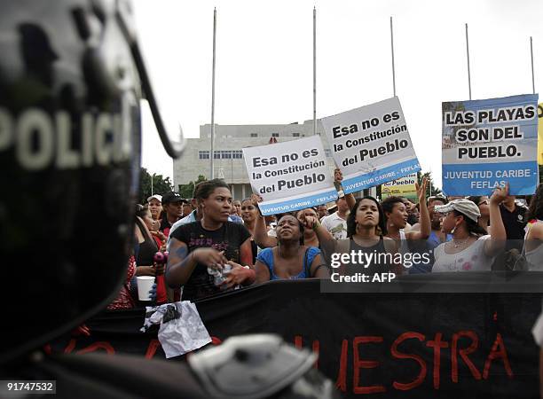 Residents take part in a protest against the National Congress in Santo Domingo on October 10, 2009. The protesters are rallying against the approval...