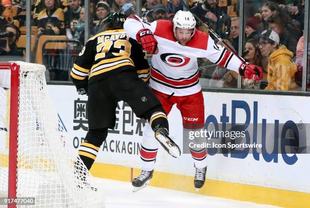 Boston Bruins right defenseman Charlie McAvoy checks Carolina Hurricanes right wing Justin Williams during a game between the Boston Bruins and the...