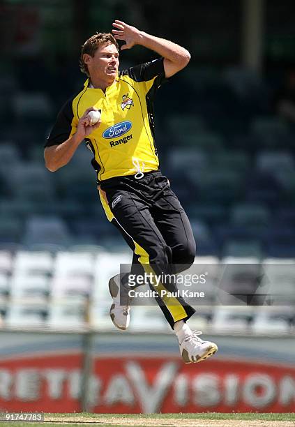 Ashley Noffke of the Warriors bowls during the Ford Ranger Cup match between the Western Australian Warriors and the Queensland Bulls at WACA on...