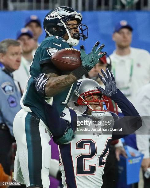 Alshon Jeffery of the Philadelphia Eagles tries to make a catch over Stephon Gilmore of the New England Patriots during Super Bowl Lll at U.S. Bank...