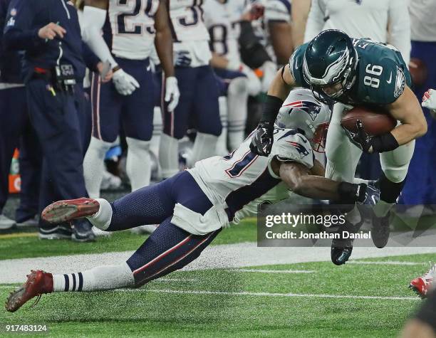 Zach Ertz of the Philadelphia Eagles is hit by Jordan Richards of the New England Patriots during Super Bowl Lll at U.S. Bank Stadium on February 4,...