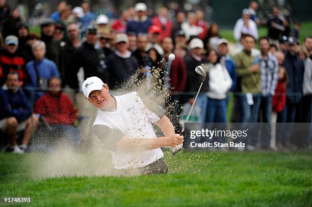 Ernie Els of the International Team chips onto the 11th green during the day three afternoon Fourball Matches of The Presidents Cup at Harding Park...