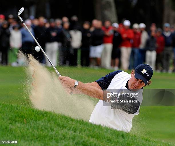 Phil Mickeslon of the U.S. Team hits onto the fifth green during the day three afternoon Fourball Matches of The Presidents Cup at Harding Park Golf...