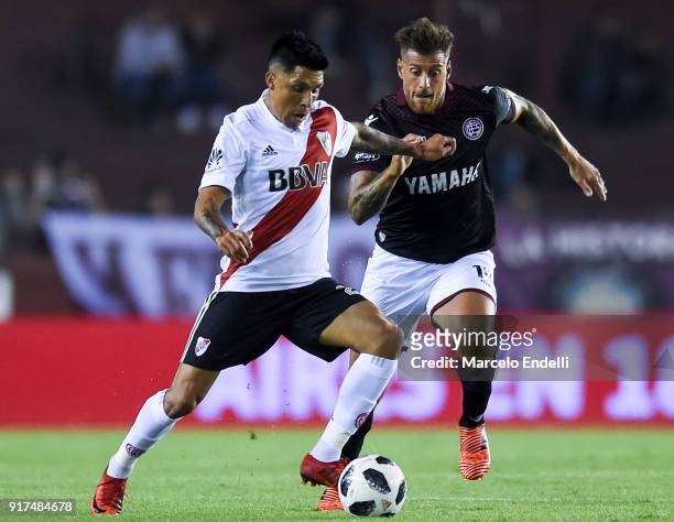 Enzo Perez of River Plate fights for ball with German Denis of Lanus during a match between Lanus and River Plate as part of the Superliga 2017/18 at...