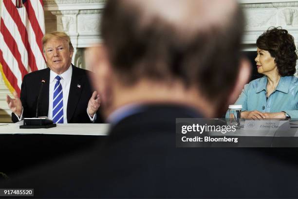 President Donald Trump, left, speaks while Elaine Chao, U.S. Transportation secretary, listens during an infrastructure initiative meeting at the...