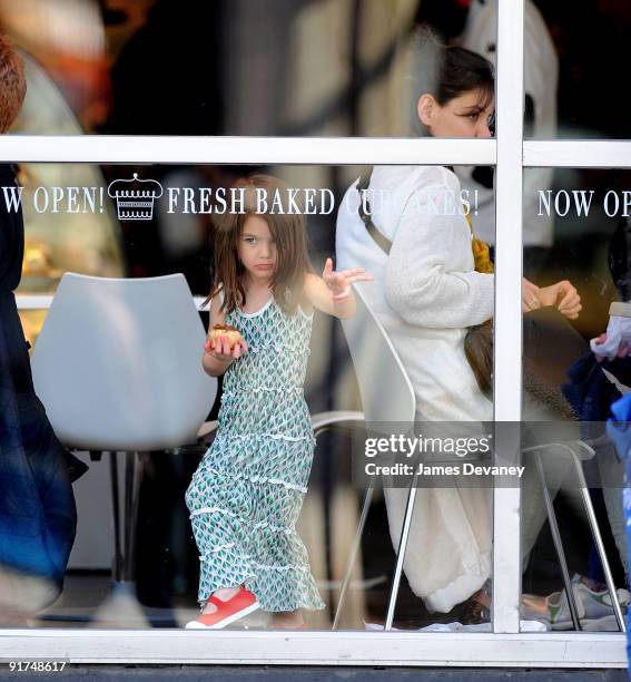 Suri Cruise and Katie Holmes visit Sweet cupcake store in Harvard Square on October 10, 2009 in Cambridge, Massachusetts.