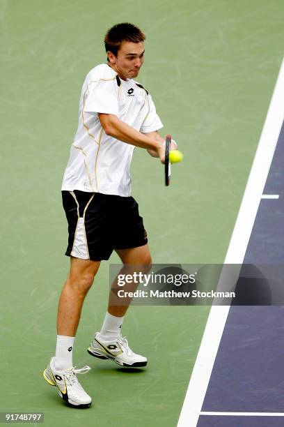 Andreas Beck of Germany returns a shot to Jose Acasuso of Argentina during day one of 2009 Shanghai ATP Masters 1000 at Qi Zhong Tennis Centre on...