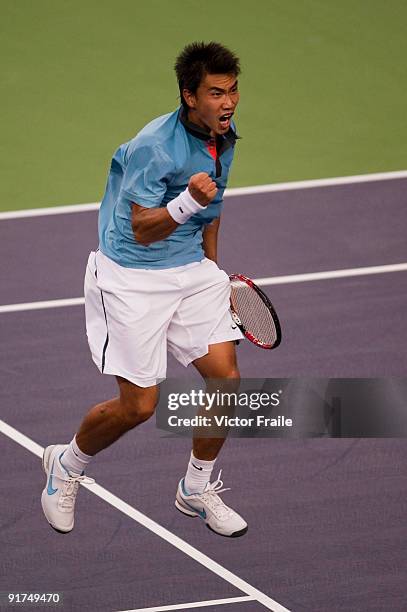 Shao-Xuan Zeng of China celebrates winning match point against Dudi Sela of Israel during the day one of the 2009 Shanghai ATP Masters 1000 at the Qi...