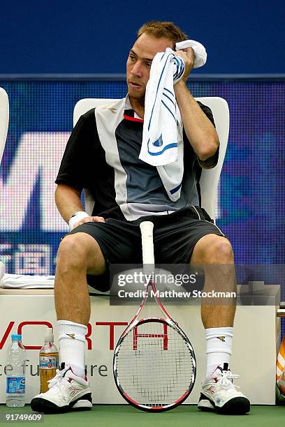 Dudi Sela of Israel towels off between games against Shao-Xuan Zeng of China during day one of the 2009 Shanghai ATP Masters 1000 at Qi Zhong Tennis...