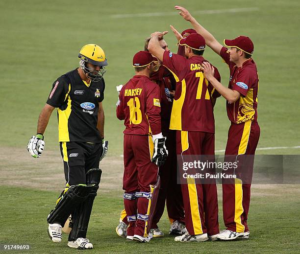 Nathan Rimmington is congratulated by team mates after dismissing Theo Doropoulos of the Warriors during the Ford Ranger Cup match between the...