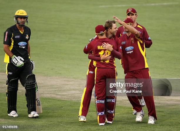 Nathan Rimmington is congratulated by team mates after dismissing Theo Doropoulos of the Warriors during the Ford Ranger Cup match between the...