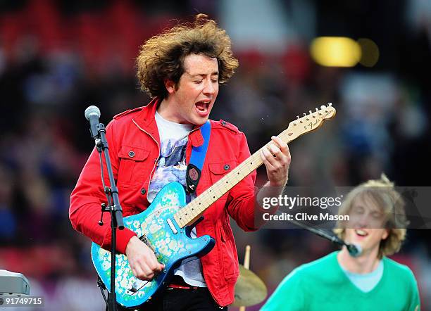 Matthew Murphy of the Wombats performs prior to the Engage Super League Grand Final between Leeds Rhinos and St Helens at Old Trafford on October 10,...