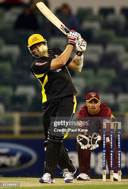 Ashley Noffke of the Warriors hits out during the Ford Ranger Cup match between the Western Australian Warriors and the Queensland Bulls at WACA on...