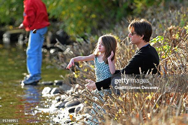 Suri Cruise and Tom Cruise visit Charles River Basin on October 10, 2009 in Cambridge, Massachusetts.