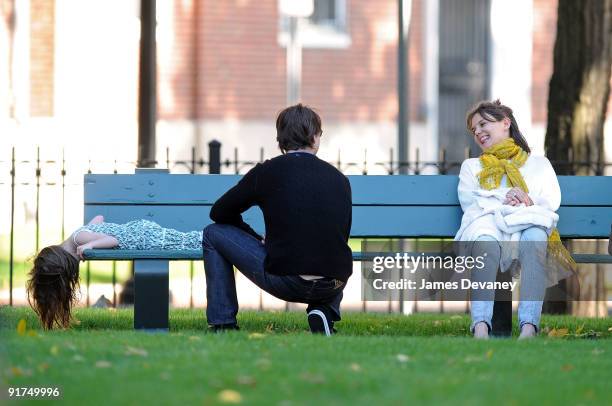 Suri Cruise, Katie Holmes and Tom Cruise visit Charles River Basin on October 10, 2009 in Cambridge, Massachusetts.