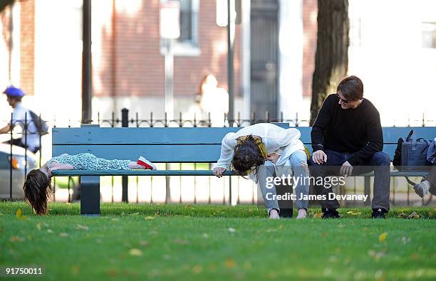 Suri Cruise, Katie Holmes and Tom Cruise visit Charles River Basin on October 10, 2009 in Cambridge, Massachusetts.